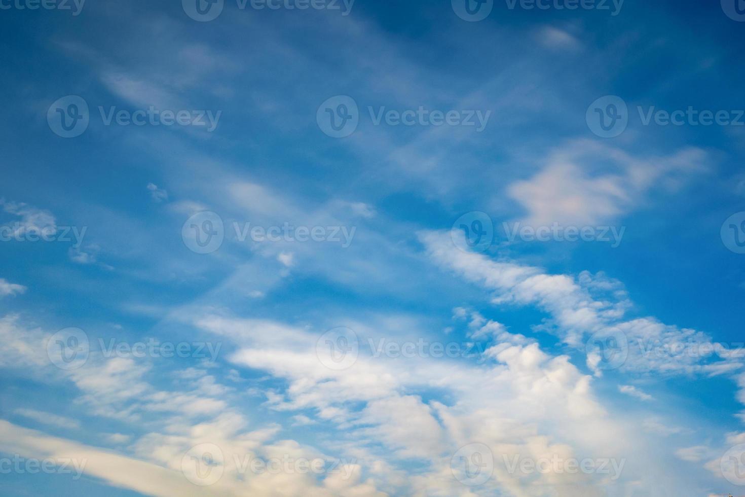 Blue sky background with tiny stratus cirrus striped clouds. Clearing day and Good windy weather photo