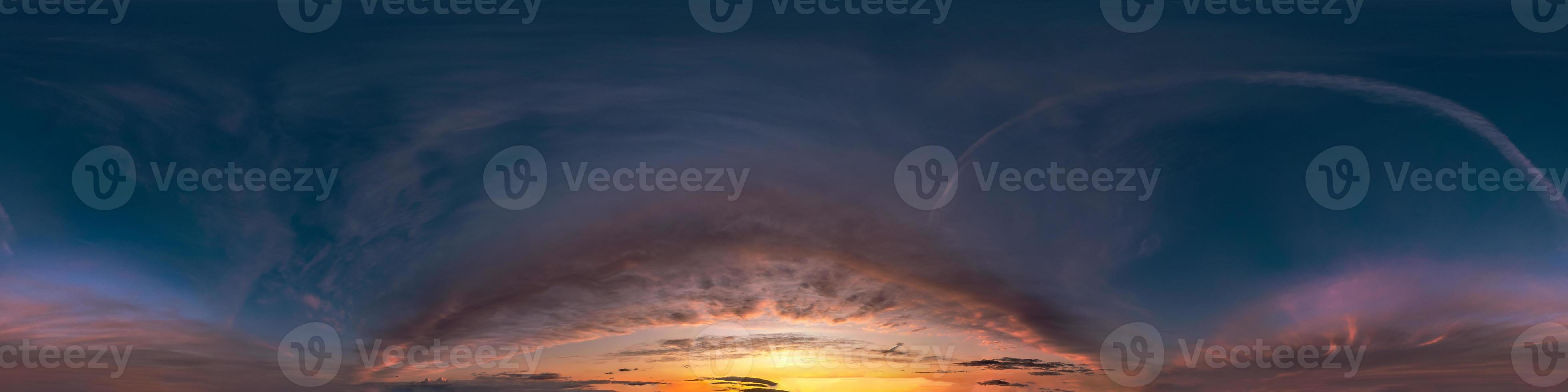 Seamless hdri panorama 360 degrees angle view of dark blue sky before sunset with beautiful awesome clouds with zenith for use in 3d graphics or game development as sky dome or edit drone shot photo