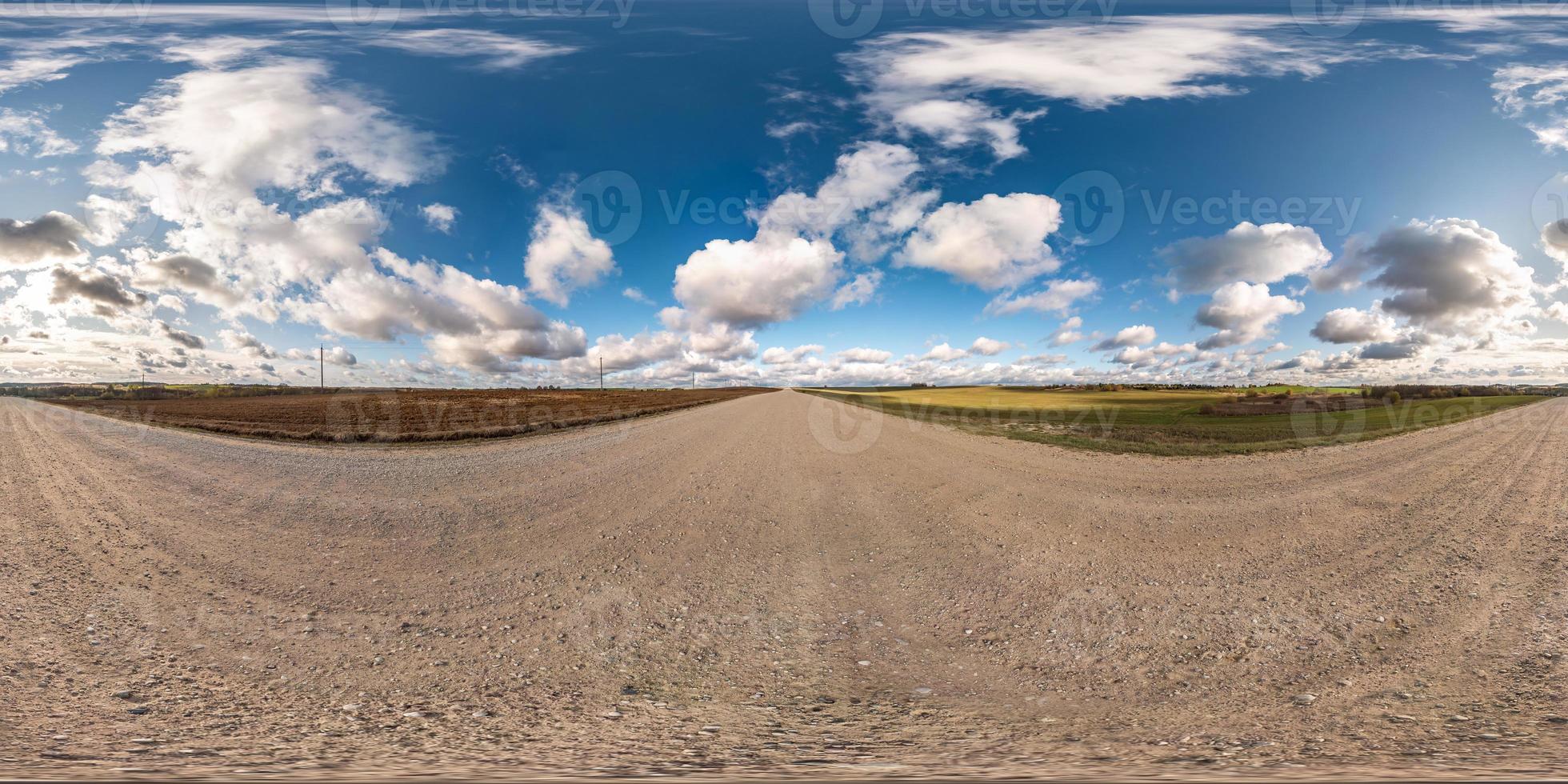 blue sky with rain storm fluffy clouds. full seamless eamless hdri panorama 360 degrees angle view on gravel road with zenith in equirectangular projection, ready for VR AR virtual reality photo