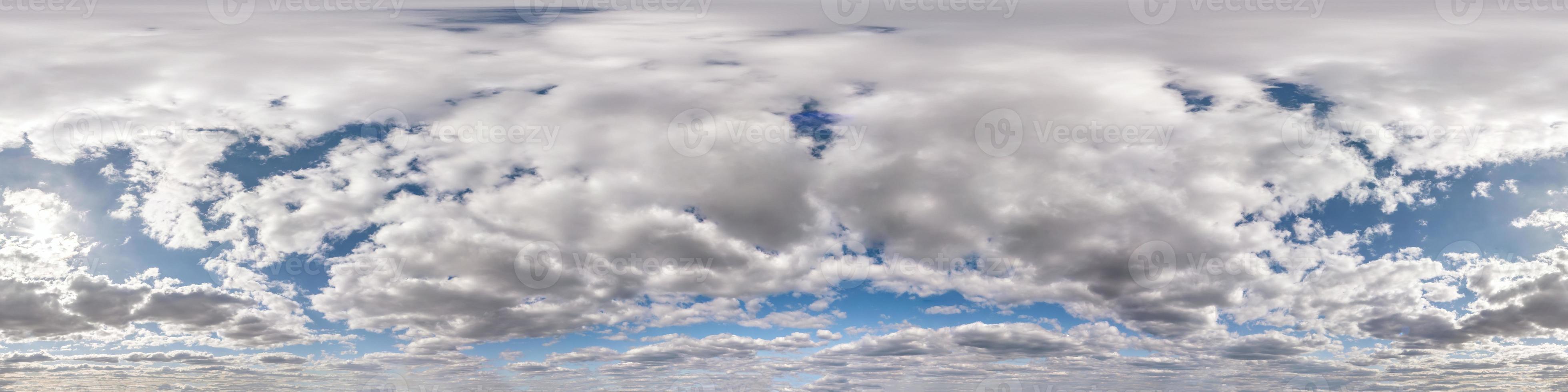 Seamless hdri panorama 360 degrees angle view blue sky with beautiful fluffy cumulus clouds with zenith for use in 3d graphics or game development as sky dome or edit drone shot photo
