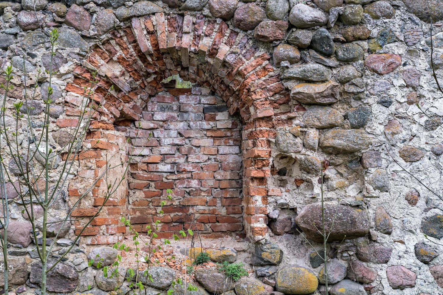 surface of an old wall of huge stones of a destroyed building photo