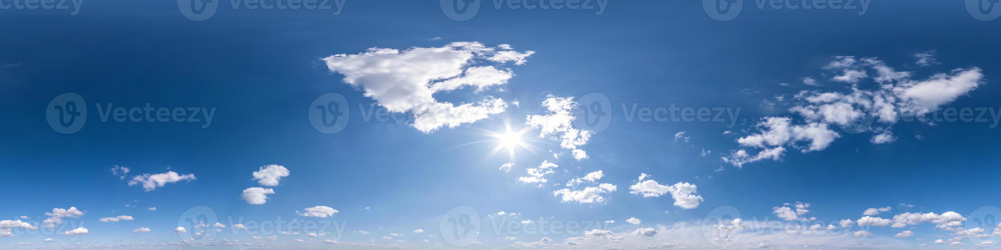 blue sky with beautiful fluffy cumulus clouds. Seamless hdri panorama 360 degrees angle view without ground for use in 3d graphics or game development as sky dome or edit drone shot photo