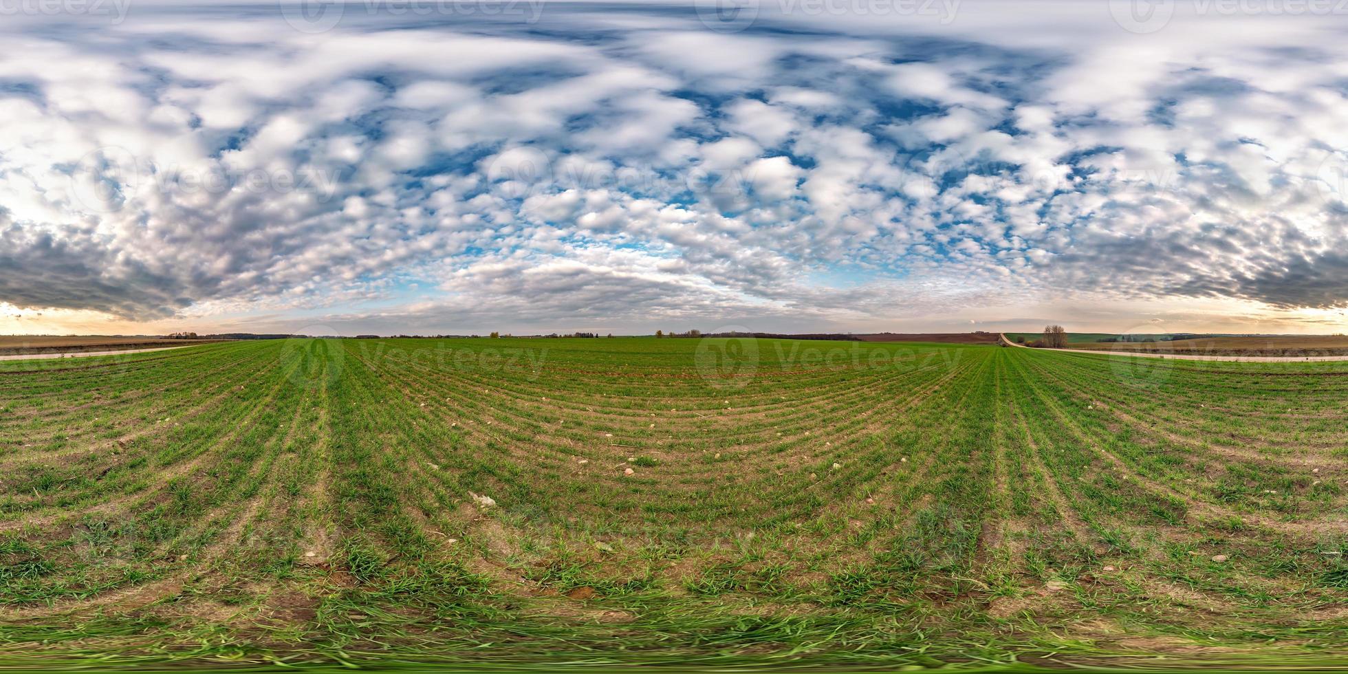 blue sky before sunset with beautiful awesome clouds. full seamless spherical hdri panorama 360 degrees angle view among fields in evening in equirectangular projection, ready for VR AR content photo