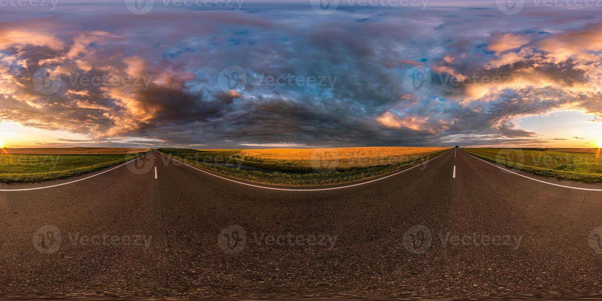 full seamless spherical hdri panorama 360 degrees angle view on asphalt road among fields in summer evening sunset with awesome clouds in equirectangular projection, ready for VR AR virtual reality photo