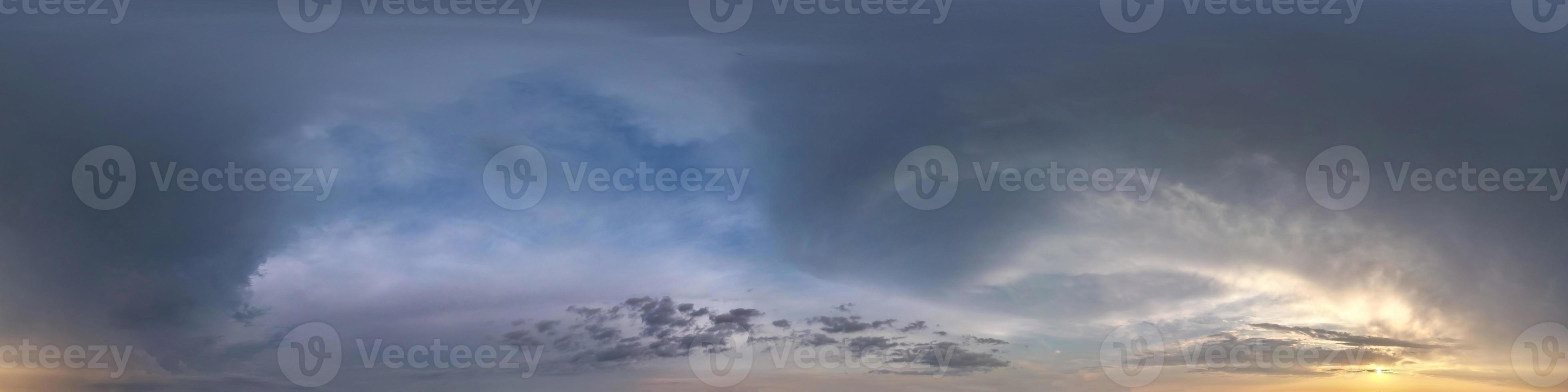 dark blue sky before sunset with beautiful awesome clouds before storm. Seamless hdri panorama 360 degrees angle view with zenith for use in graphics or game development as sky dome or edit drone shot photo