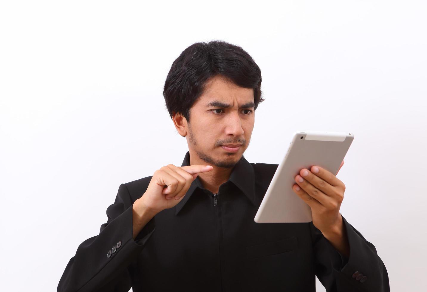 Happy man using digital tablet photo