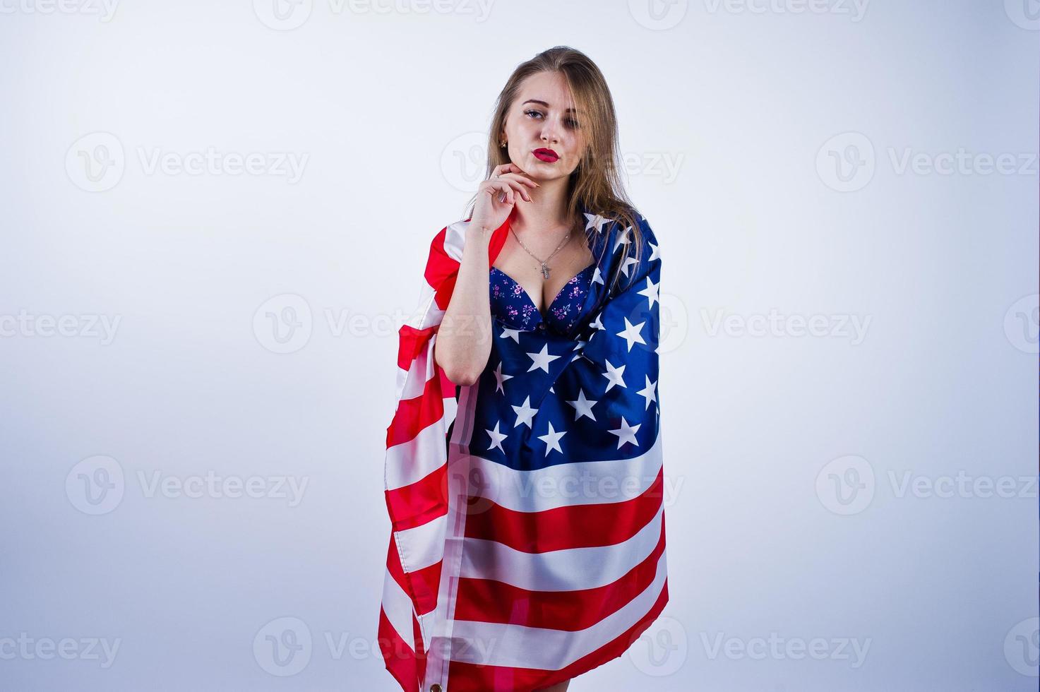 Cute girl in bra with american usa flag isolated on white background. photo