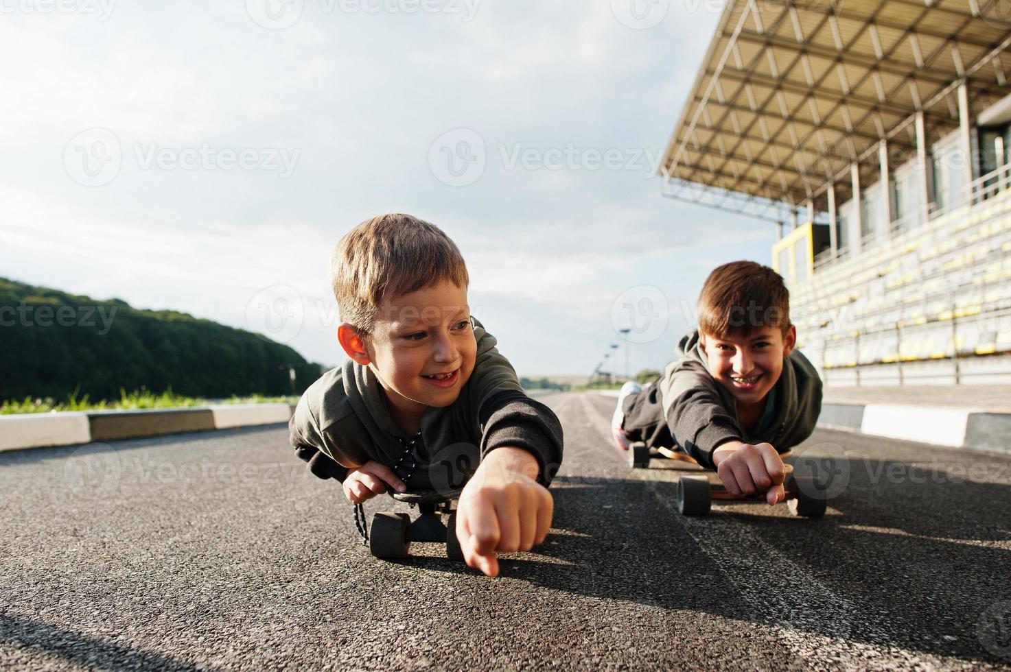 Two boys in skates. Brother's love. photo
