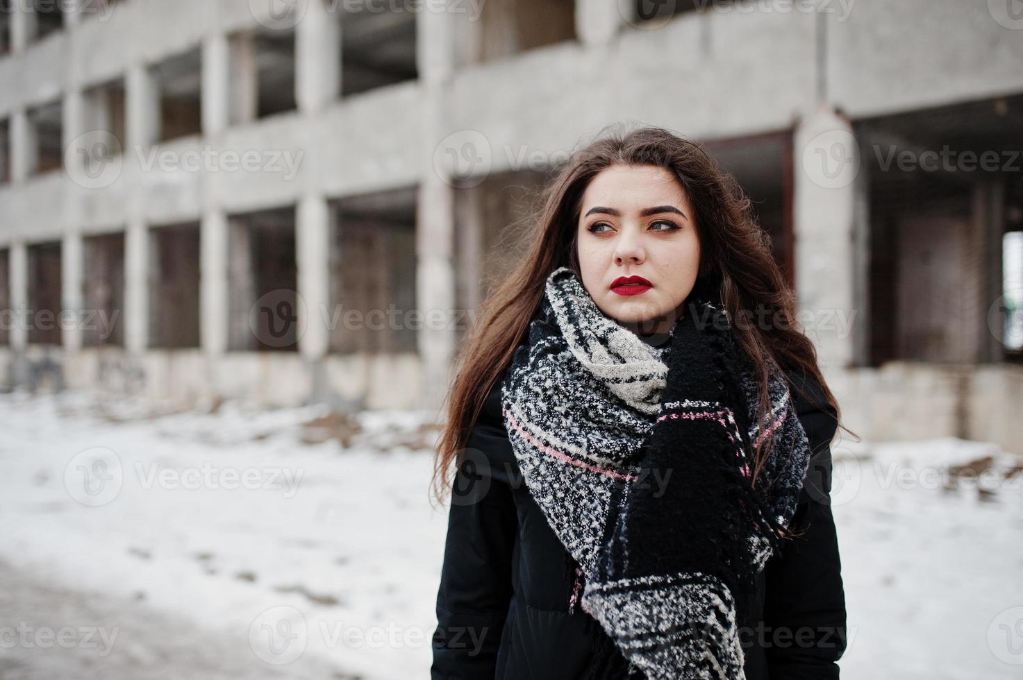 Brunette stylish casual girl in scarf against abandoned factory place. photo