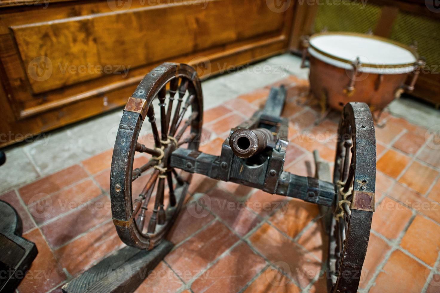 Very old cannon made of iron in museum. photo