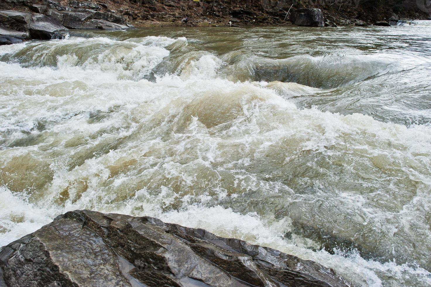 Incredible and stormy Prut river at Carpathian mountains, Jaremcze resort, Ukraine, Europe. photo