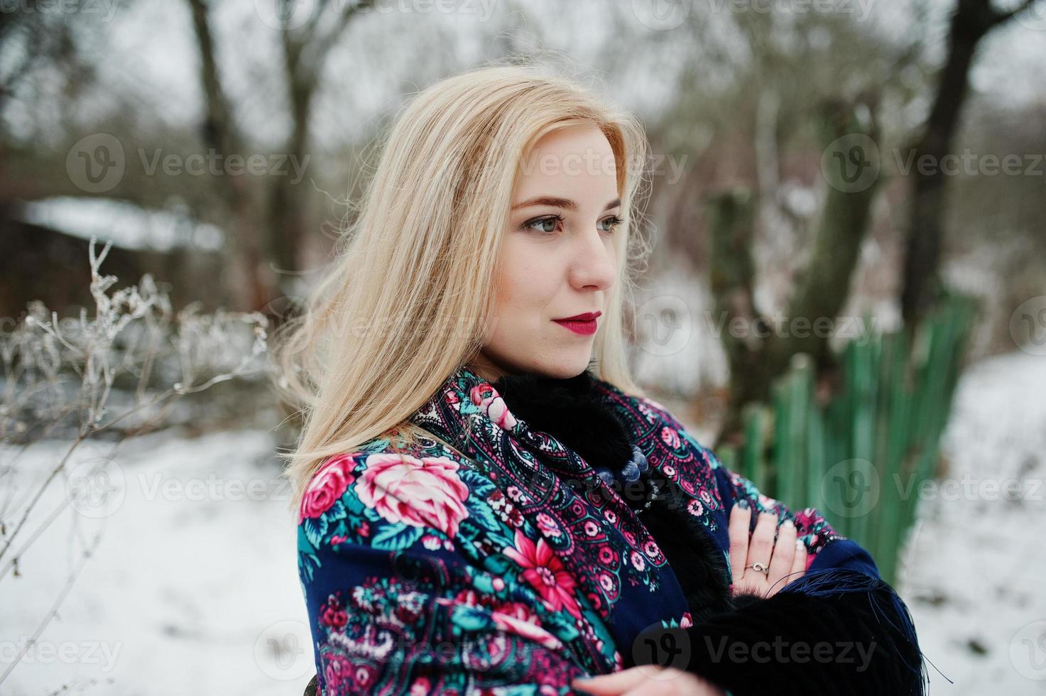 Blonde girl with hand embroidered scarf posed at winter day. Women's handkerchief. photo