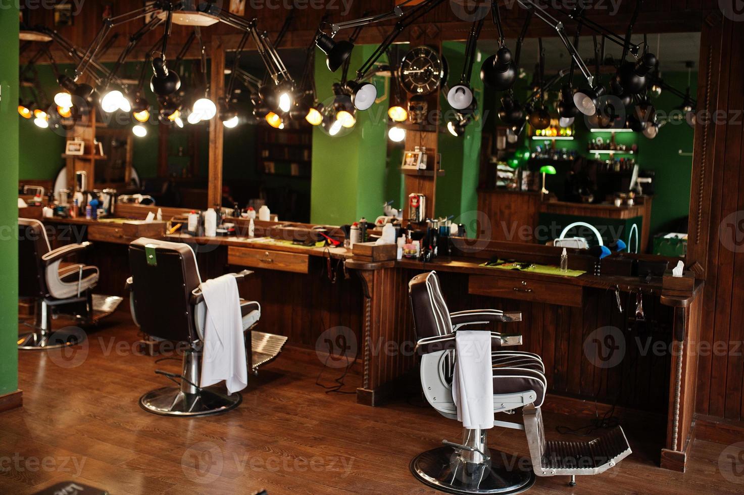 Brown vintage leather chairs at stylish barber shop. photo