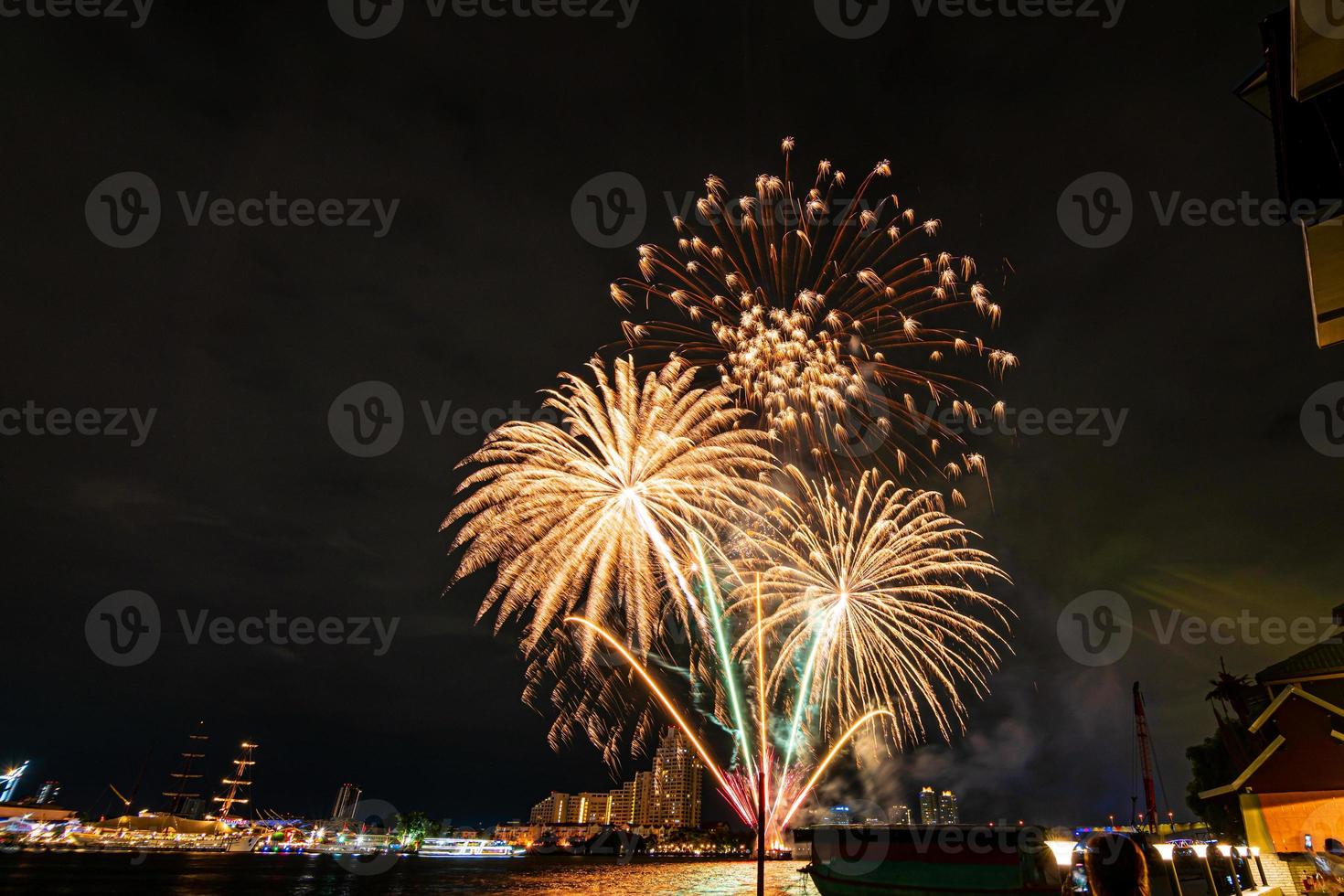 fireworks on the river in the dark sky photo