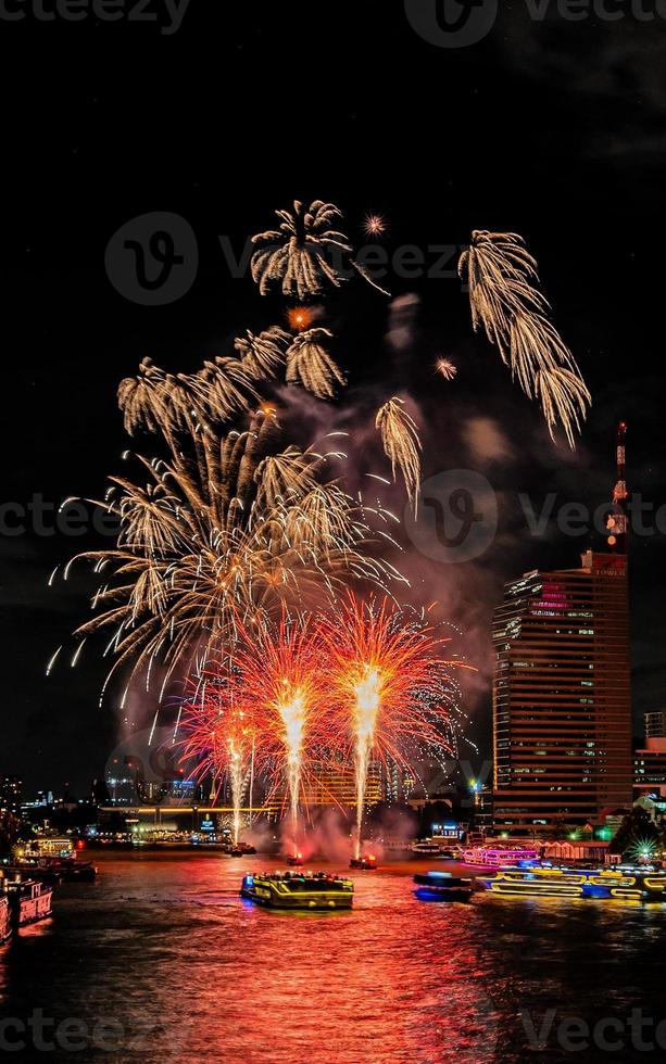 fireworks on the river in the dark sky photo