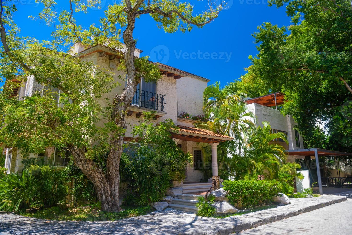 Luxury authentic historical villa in shadow of trees in Playa del Carmen, Yukatan, Mexico photo
