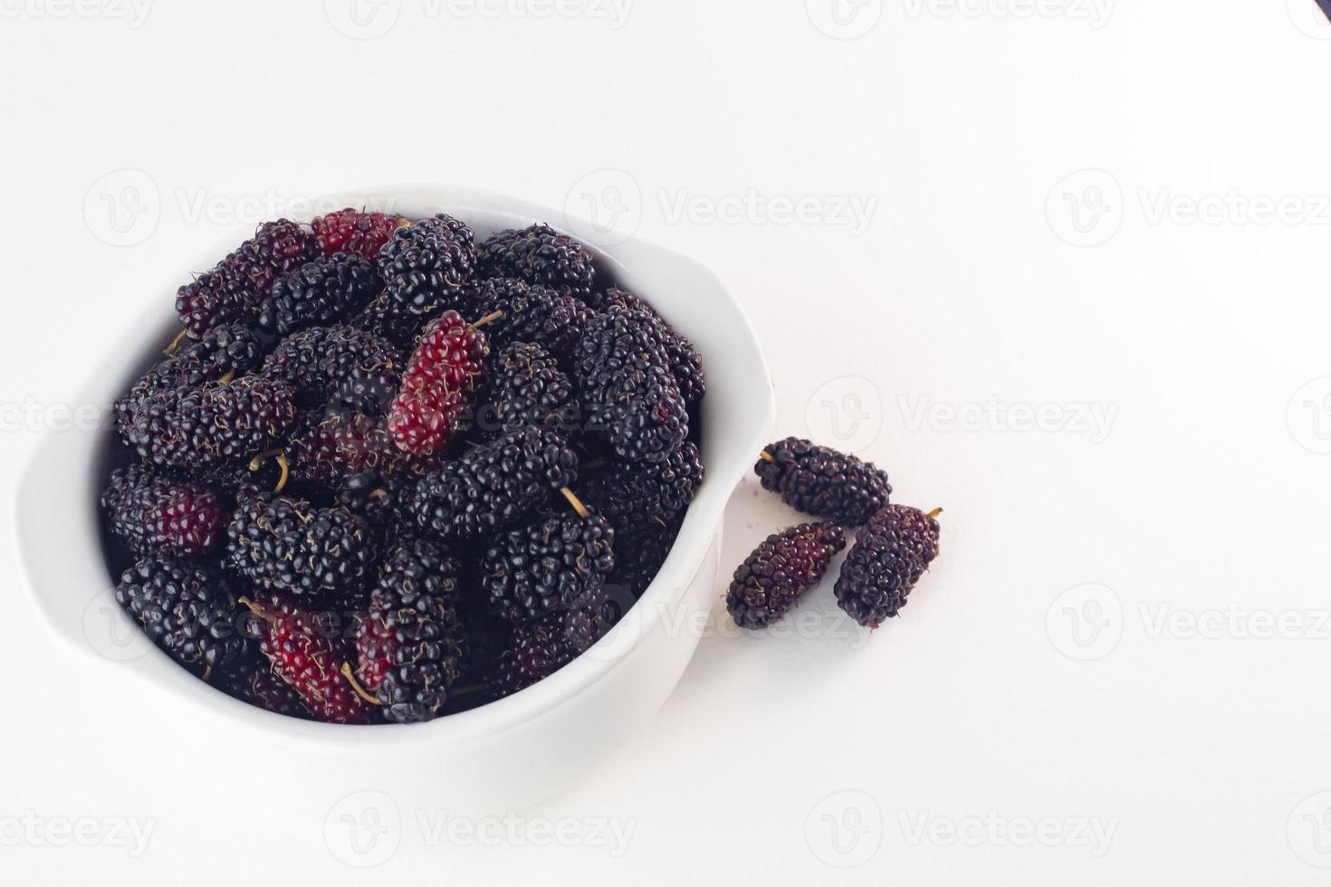 The mulberry fruit image on white background . photo