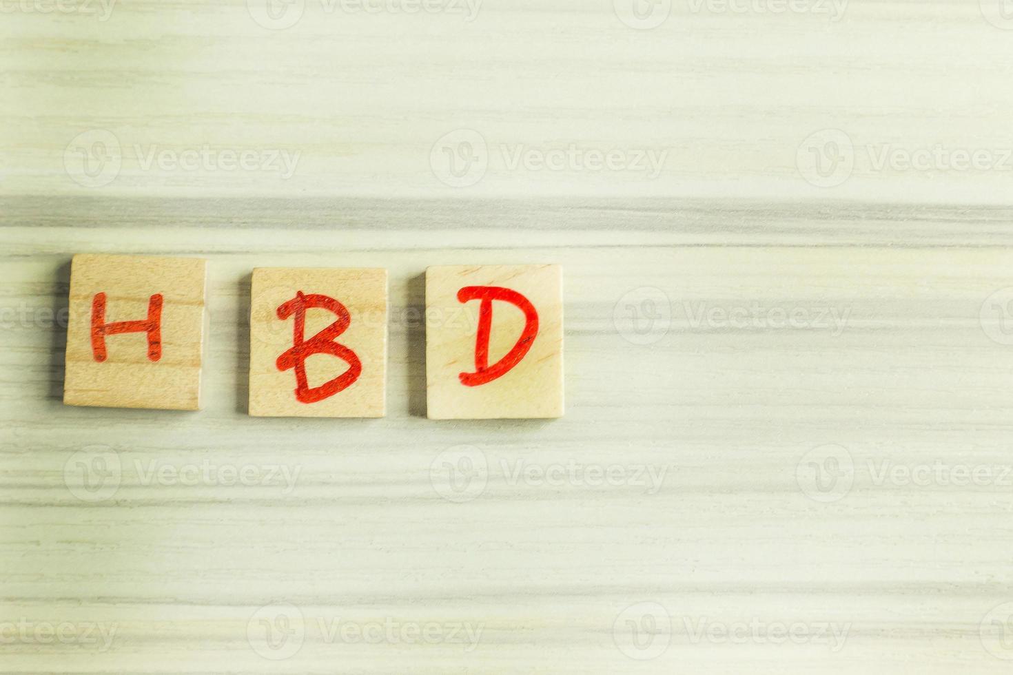 alphabet on small plate on wood table for happy birthday image. photo