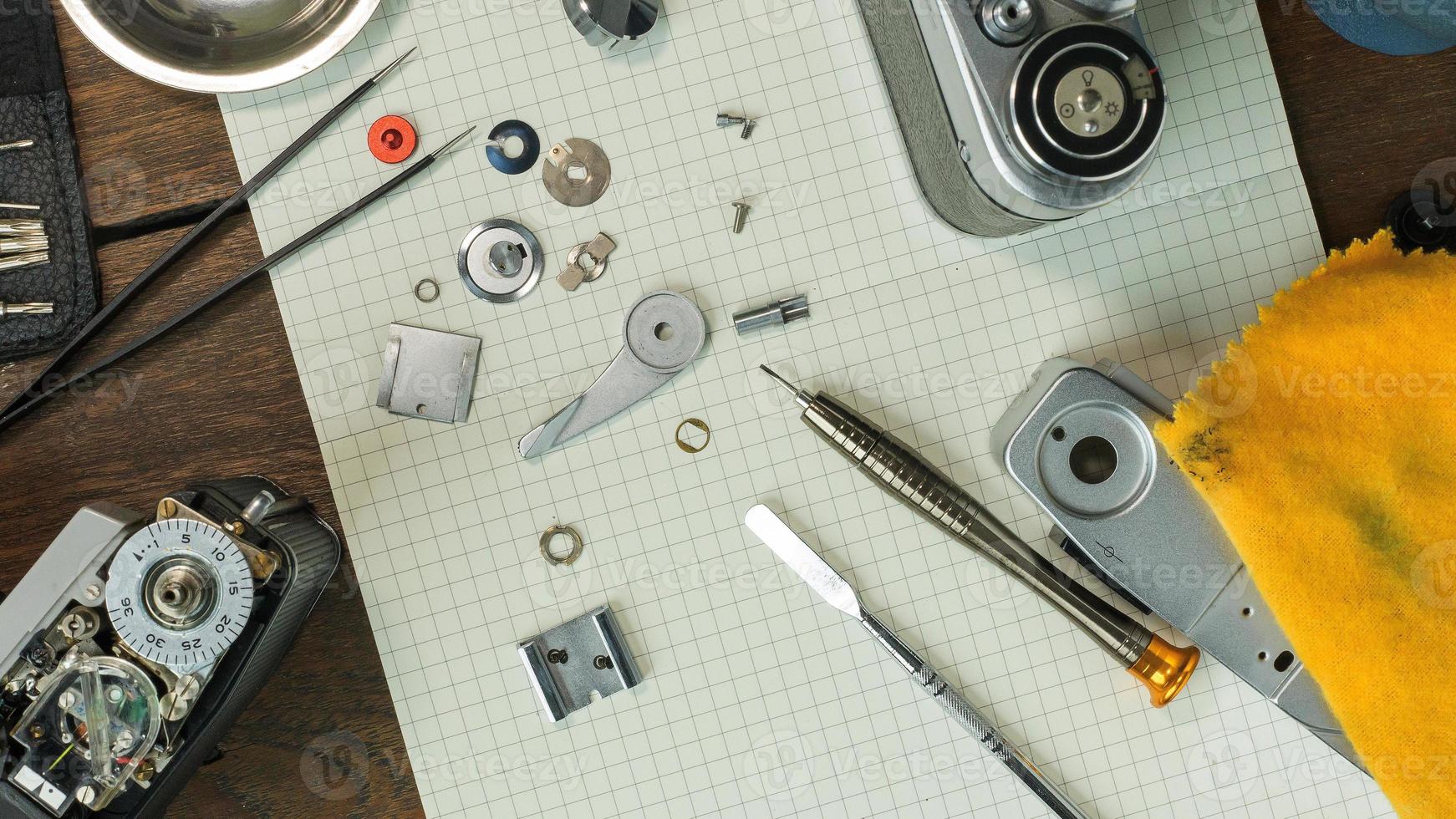 The vintage camera film service, adjustment and alignment. Camera lens repair photo