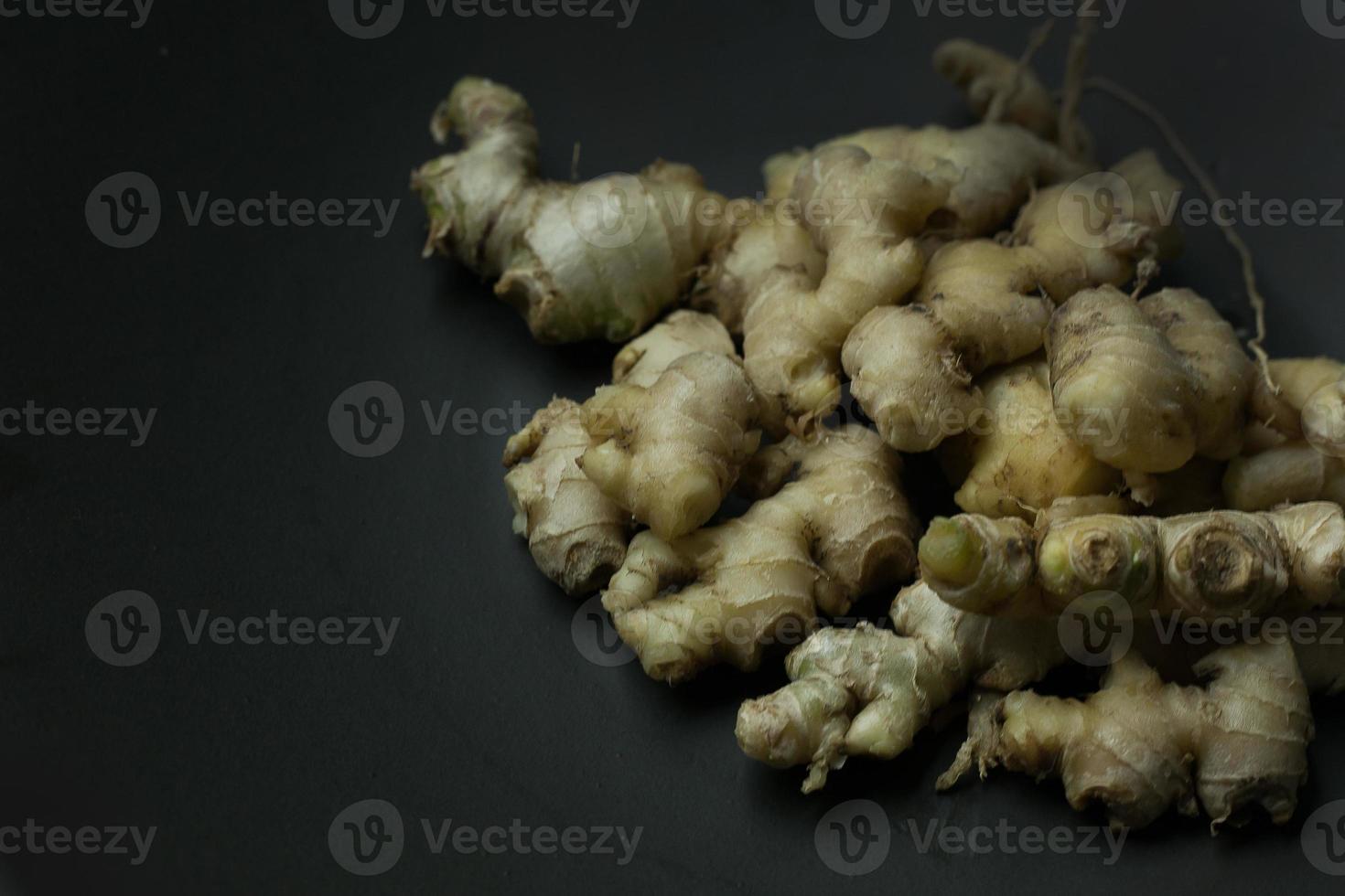 Ginger on black plate for food content. photo