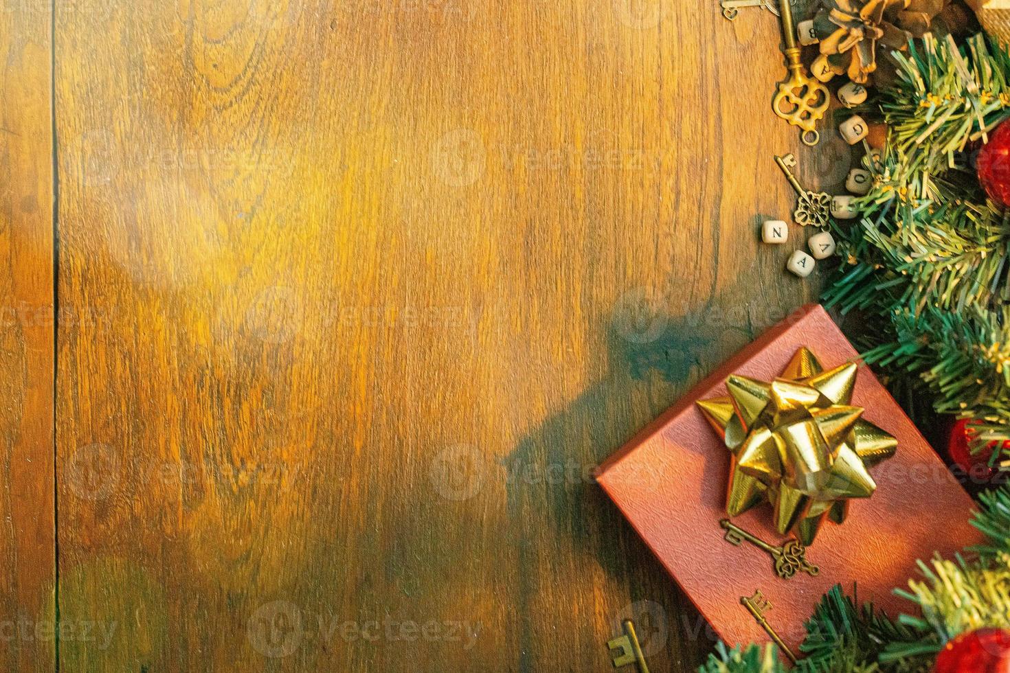 Christmas decorations on wood table for holiday content. photo