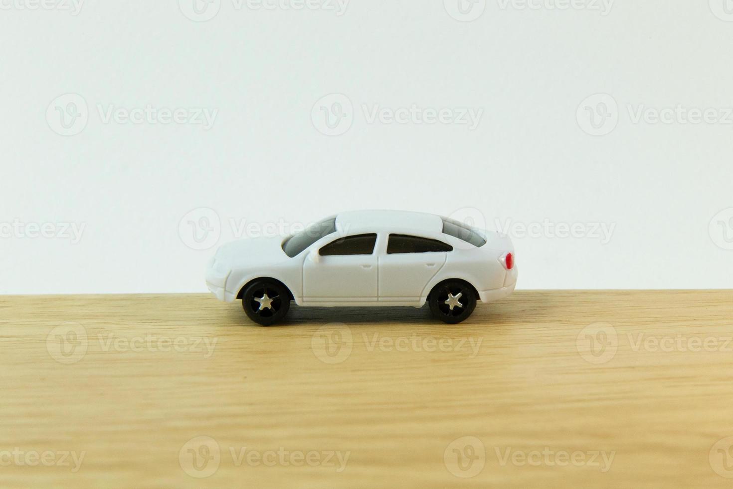 white car toy on wood table  image close up. photo