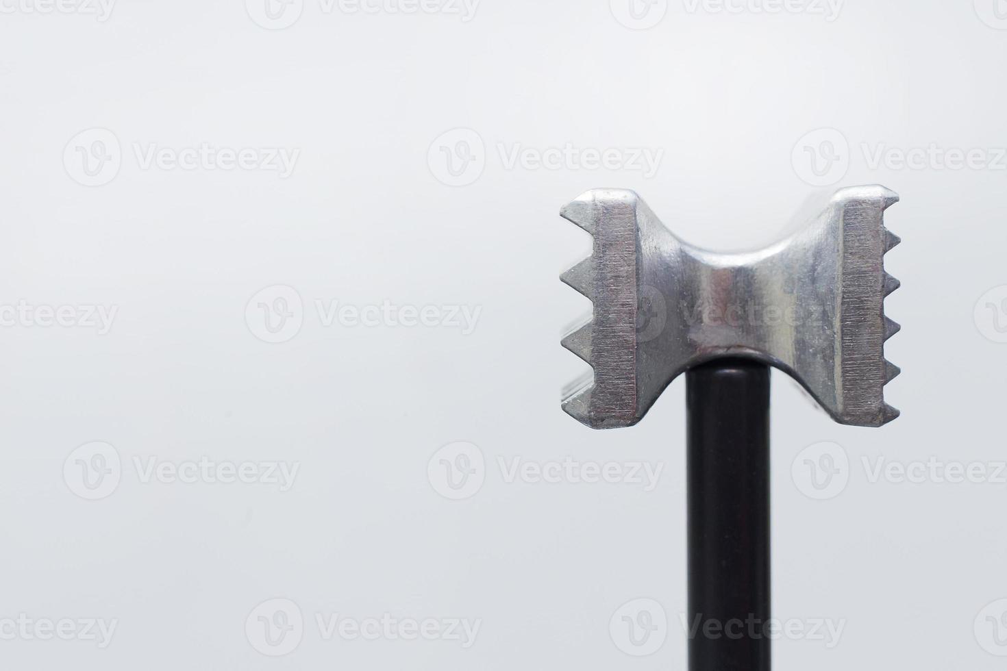 steel meat hammer close up image on white background studio light. photo