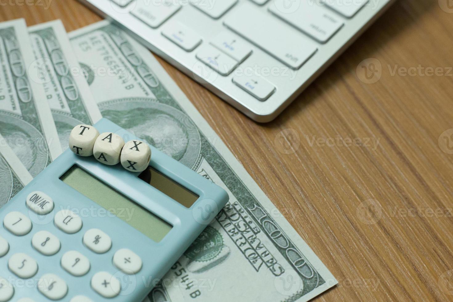 Tax wooden cubic on work table for business content. photo