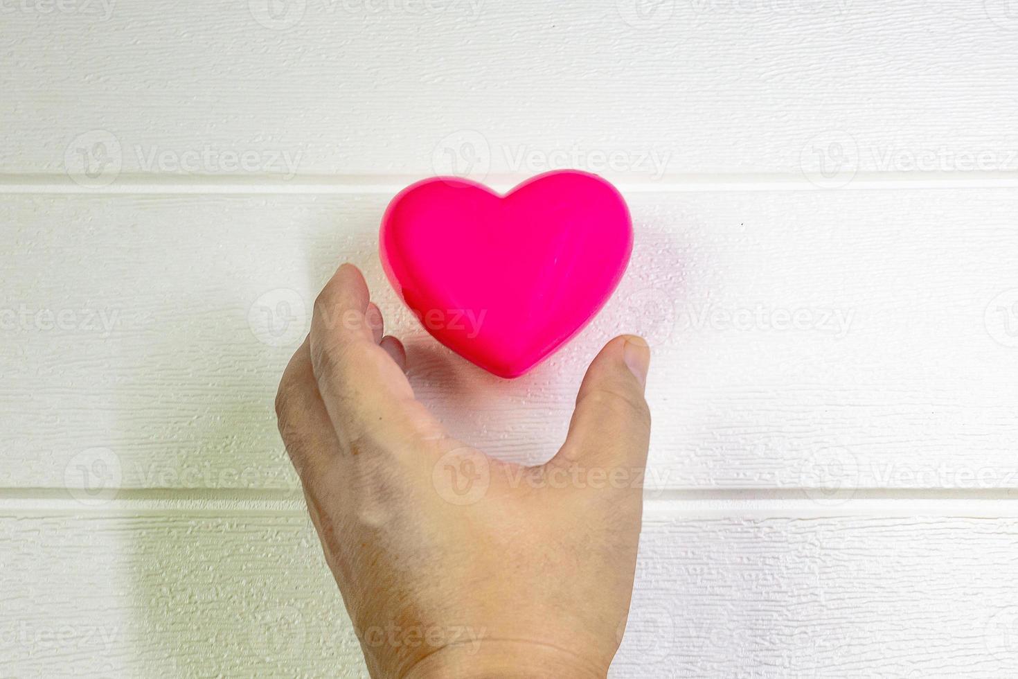 pink Heart and hand for medical content. photo