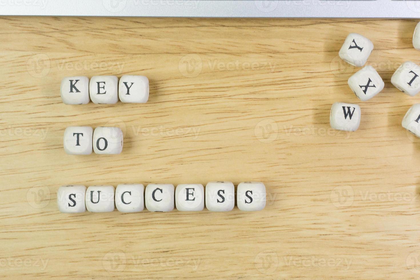 concept key to success on  wood cube for background. photo