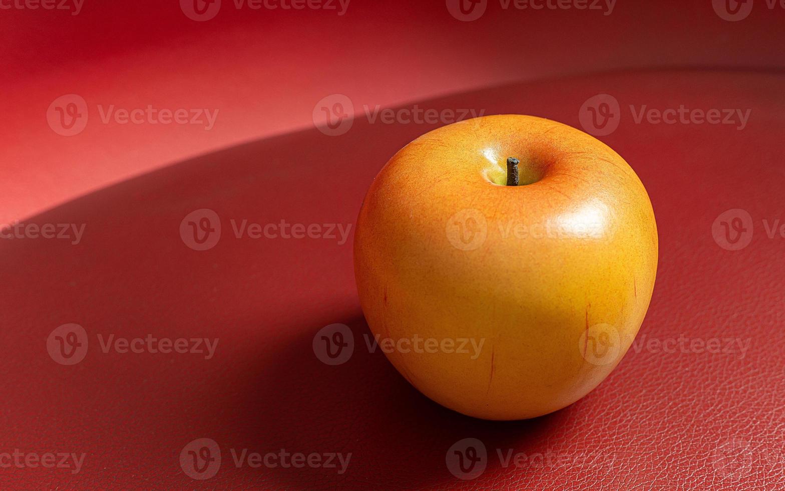 Apple on red background low light for food content. photo