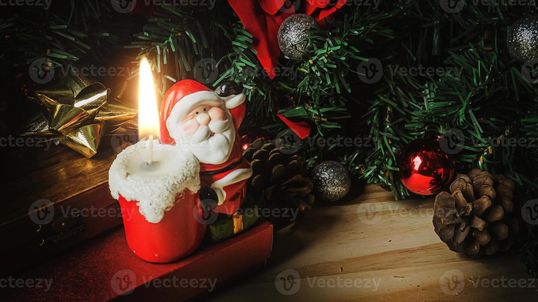Santa Claus candle on wood table for Christmas  content. photo