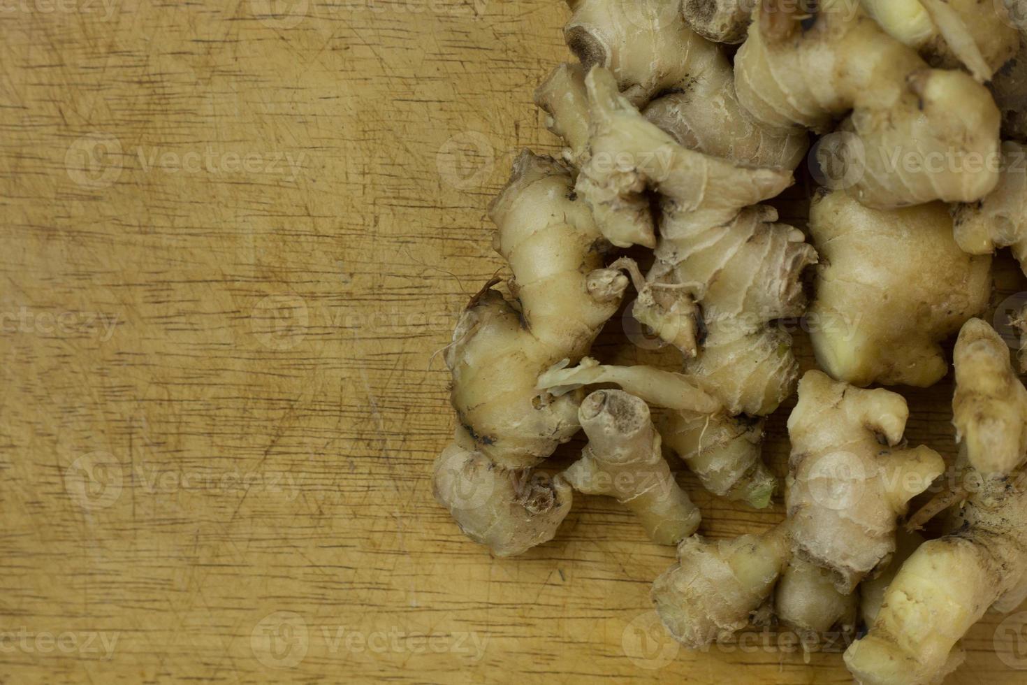 Ginger on wood plate for food content. photo