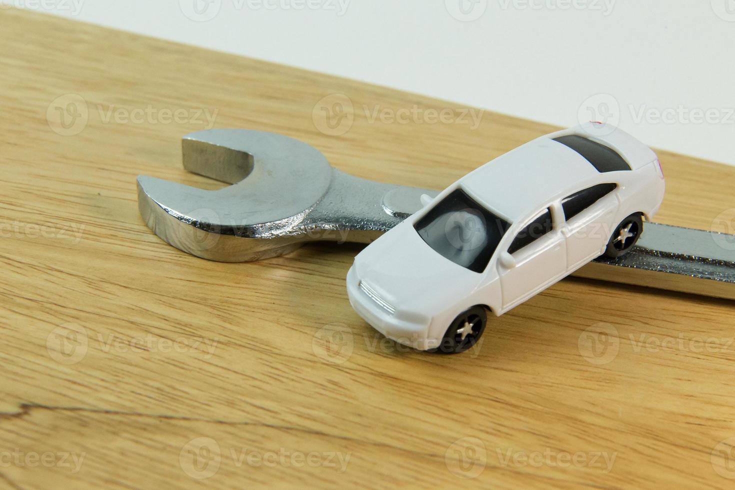 white car toy on wood table  image close up. photo