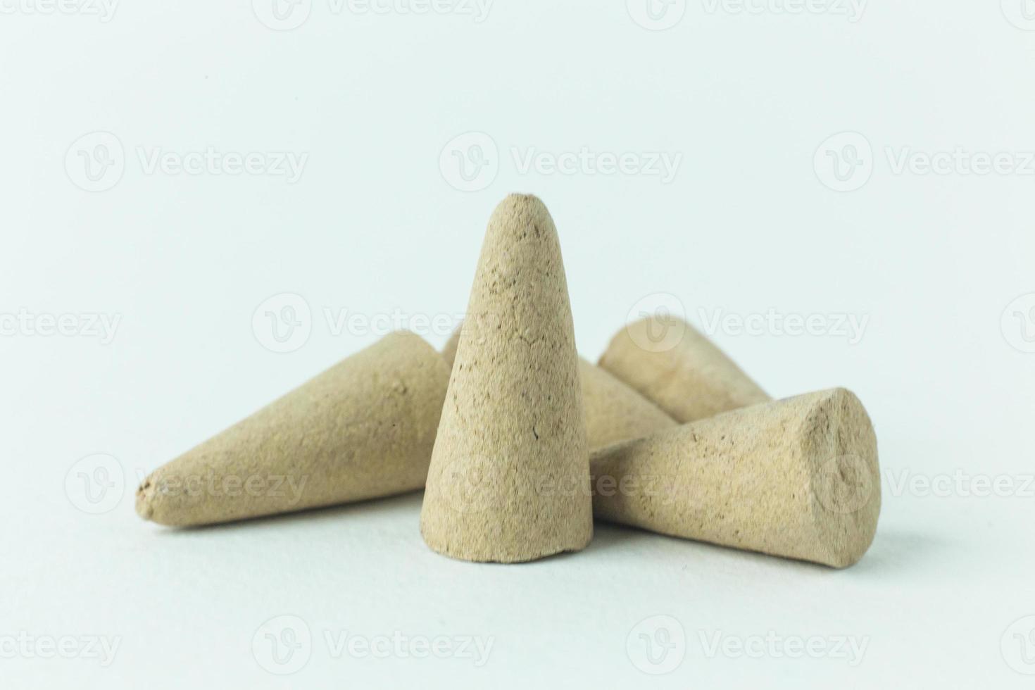 Incense Cone in a stand with the feather for background. photo