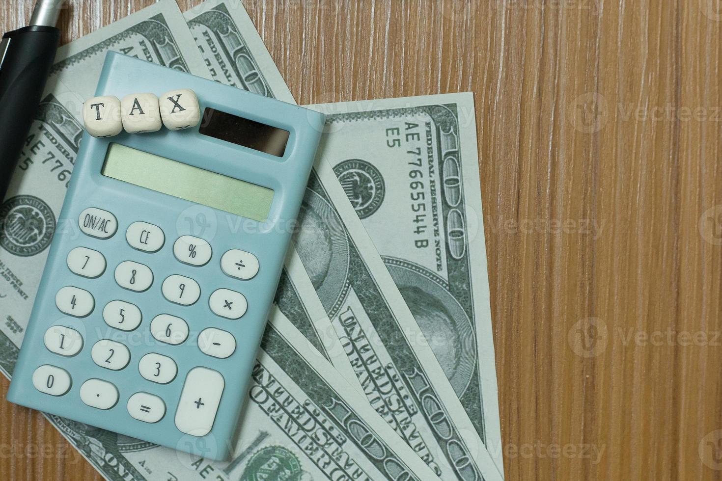 Tax wooden cubic on work table for business content. photo