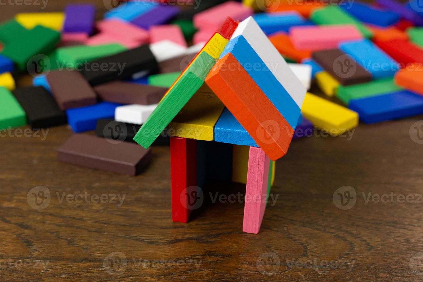 The domino multi color build home on wood table image. photo
