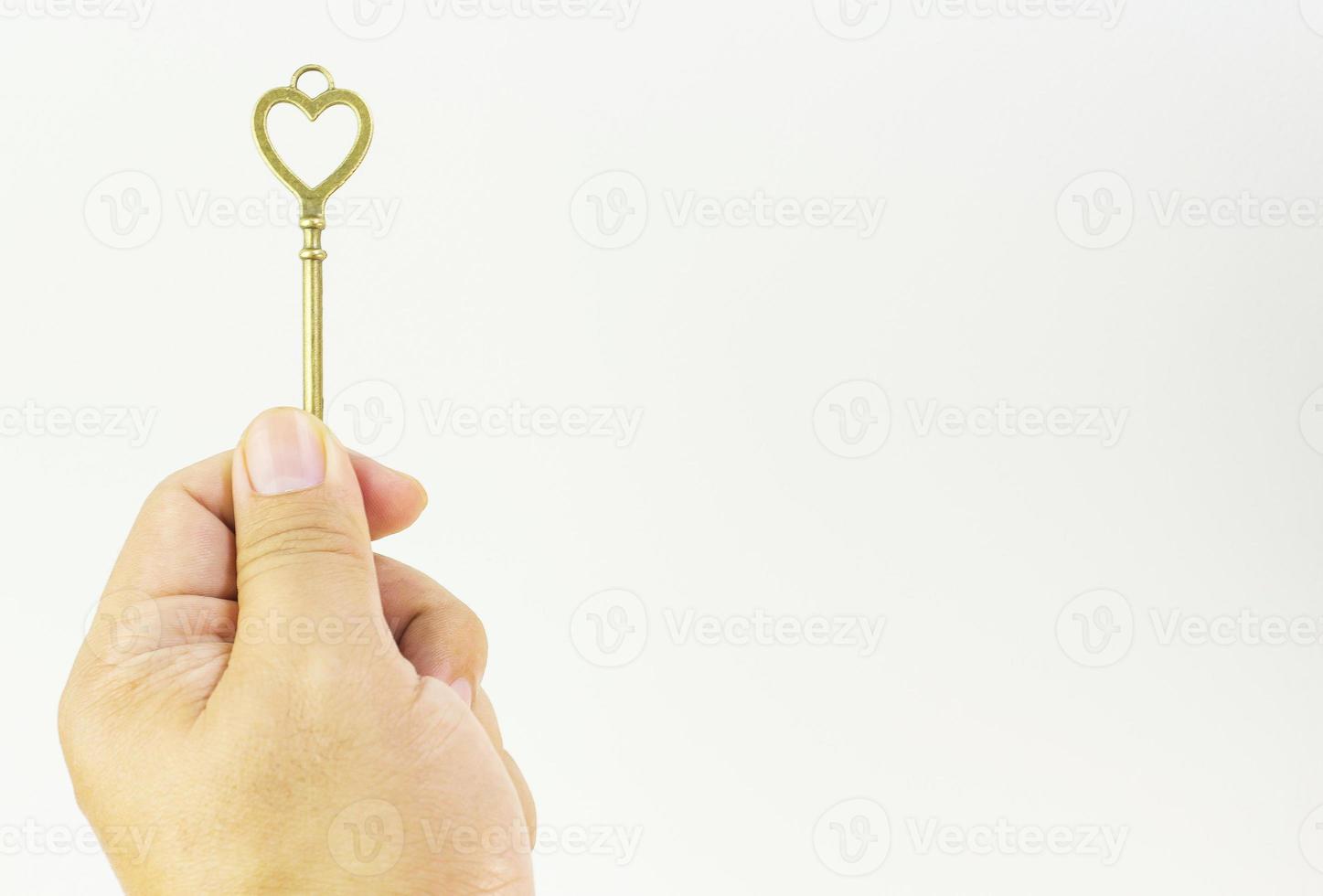 vintage gold key in hand close up image. photo