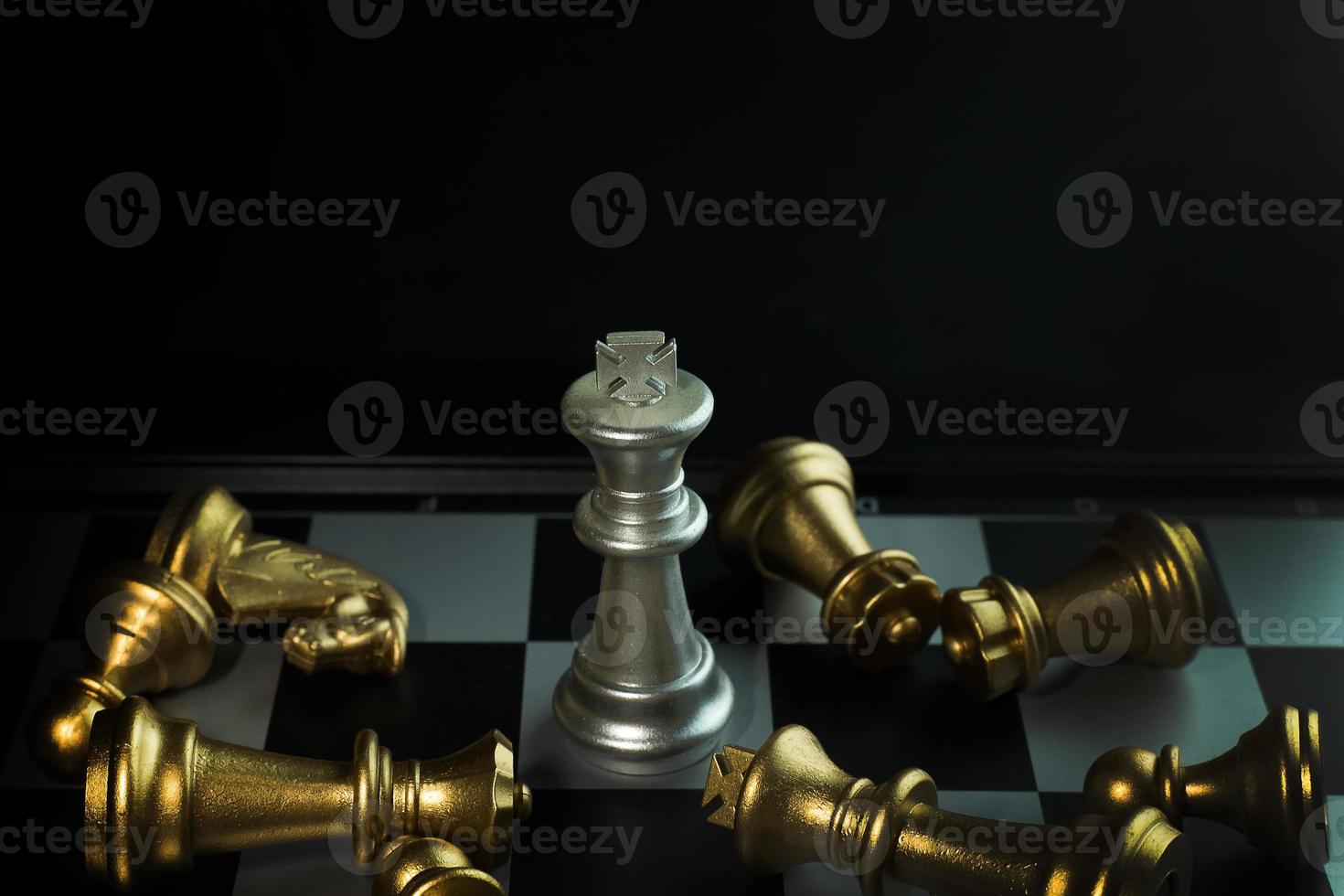 gold and silver chess on board close up image abstract Background. photo