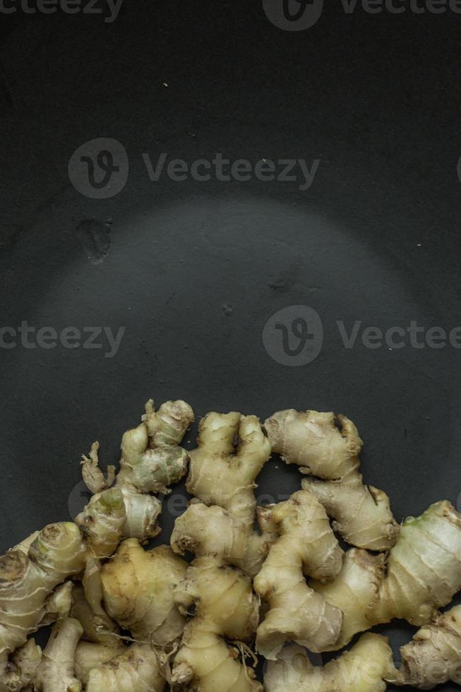 Ginger on black plate for food content. photo