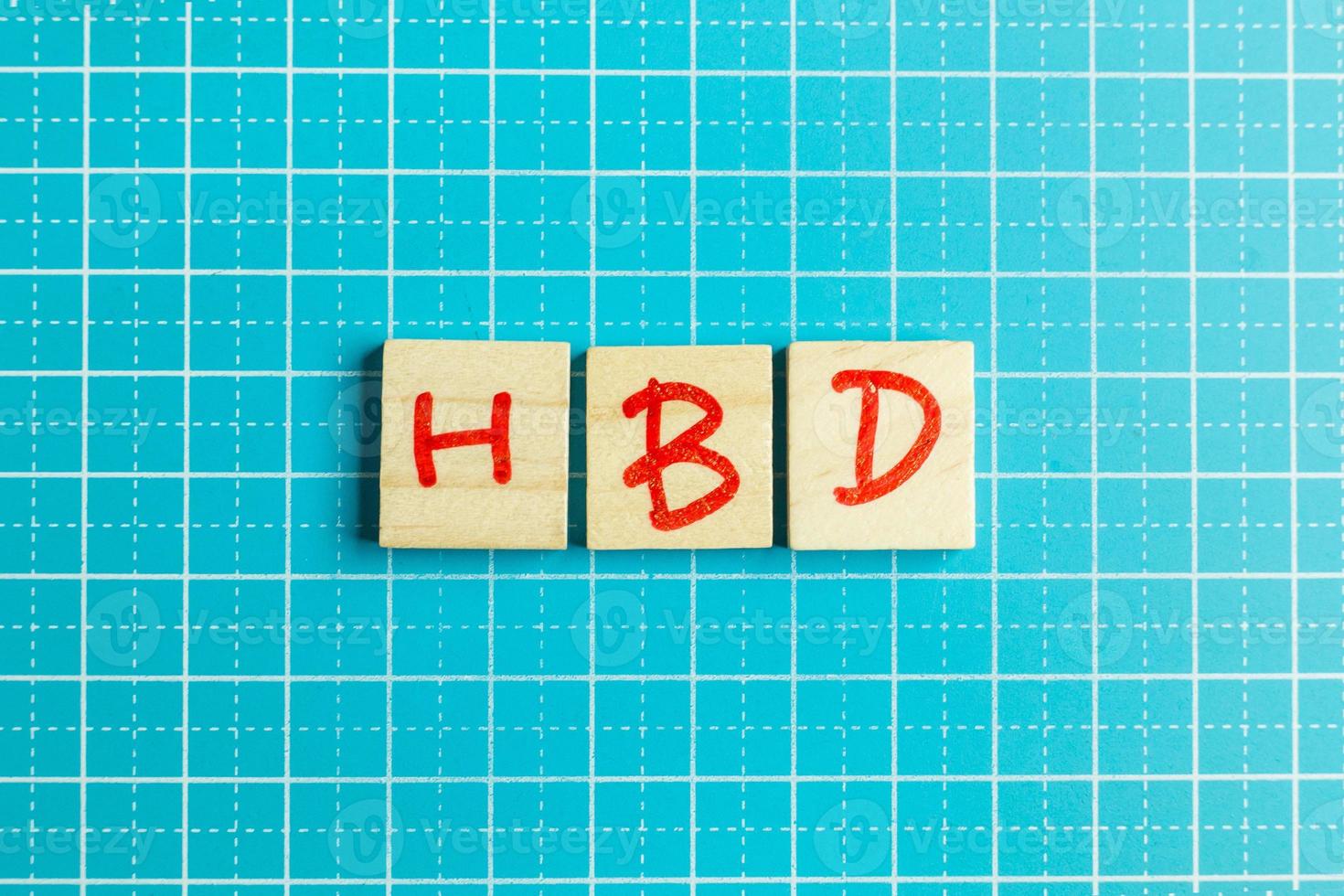 alphabet on small plate on wood table for happy birthday image. photo