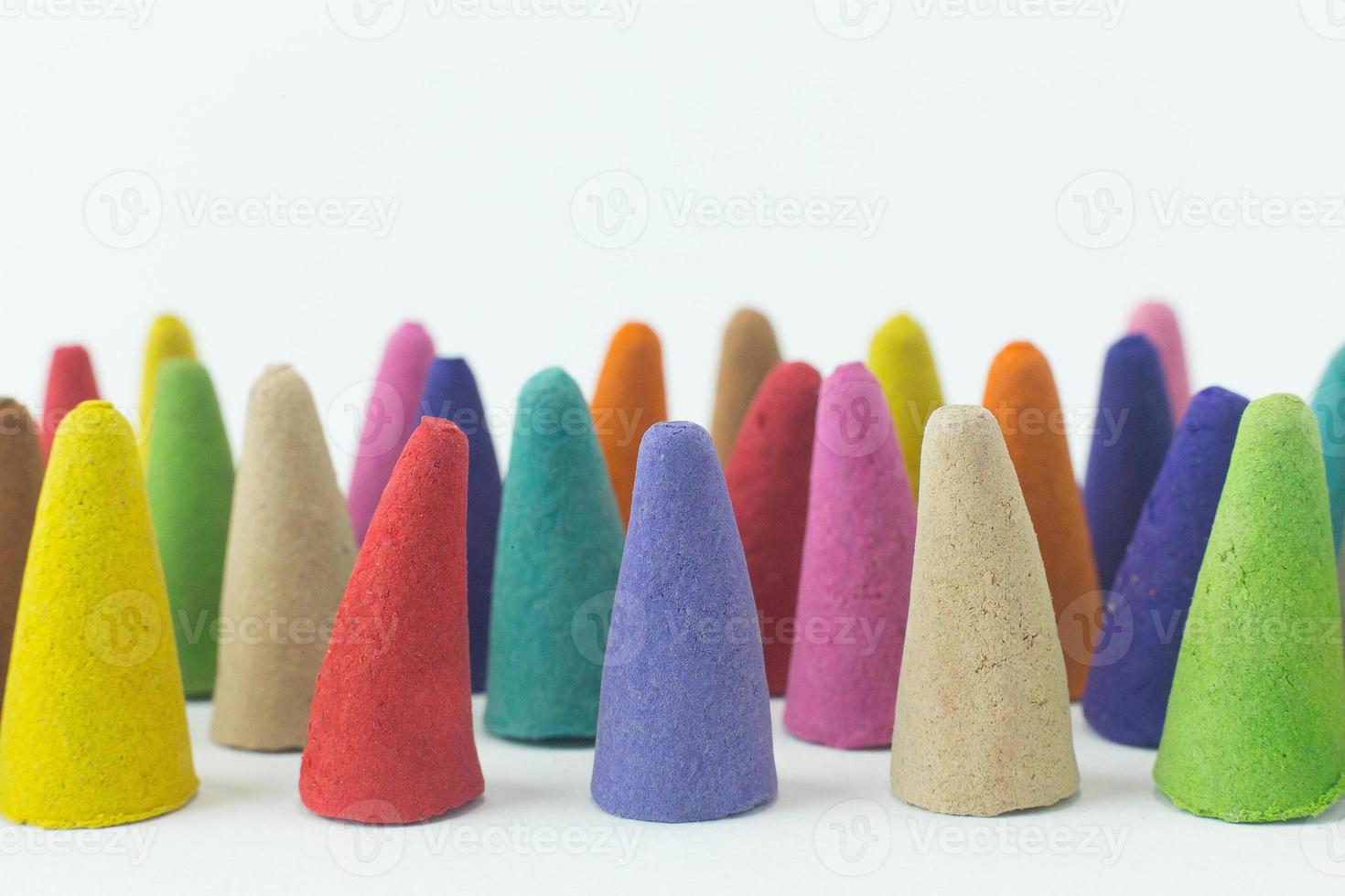 Incense Cone in a stand with the feather for background. photo