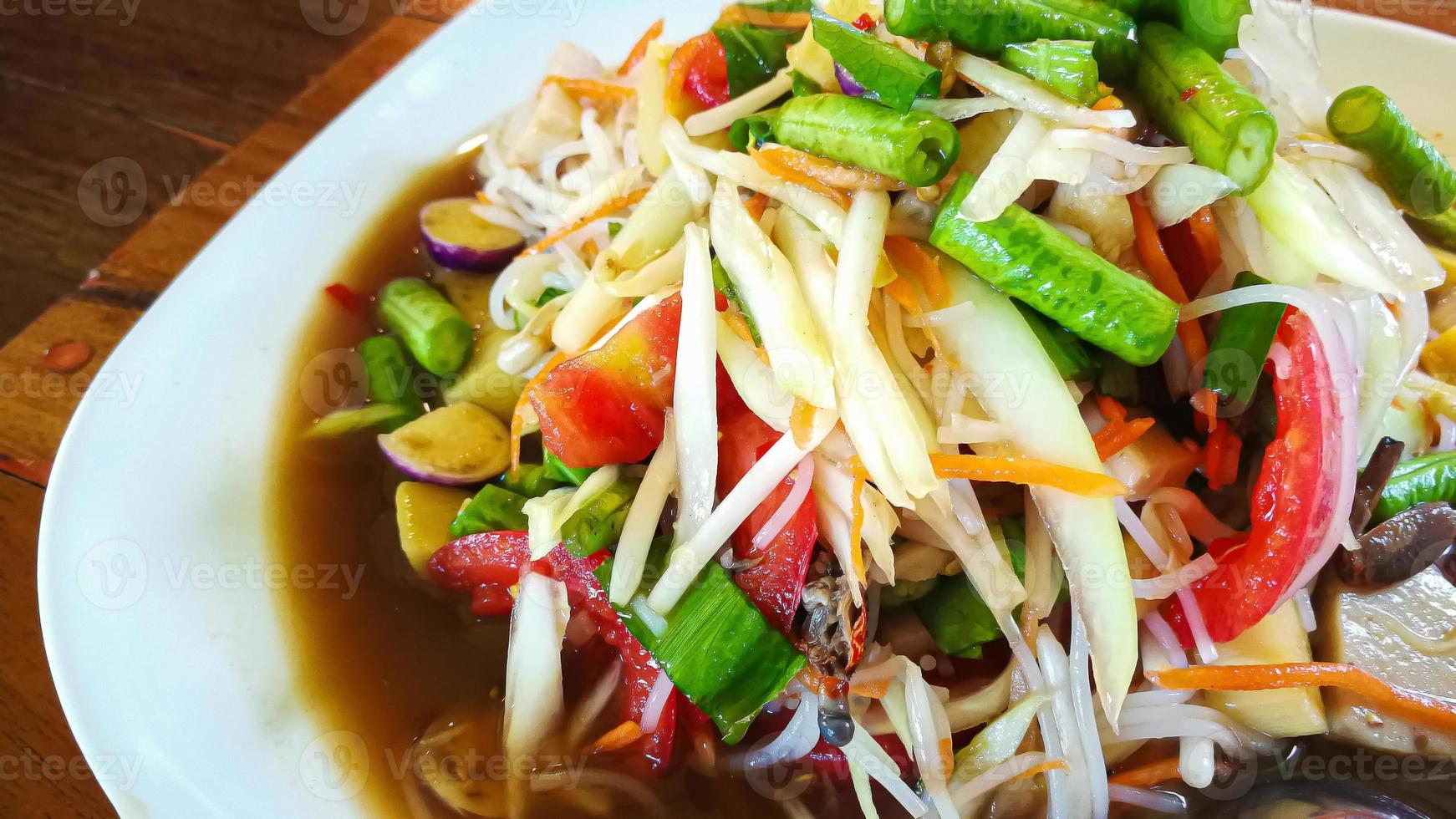 The Somtam or green Papaya Salad Thai food close up image. photo