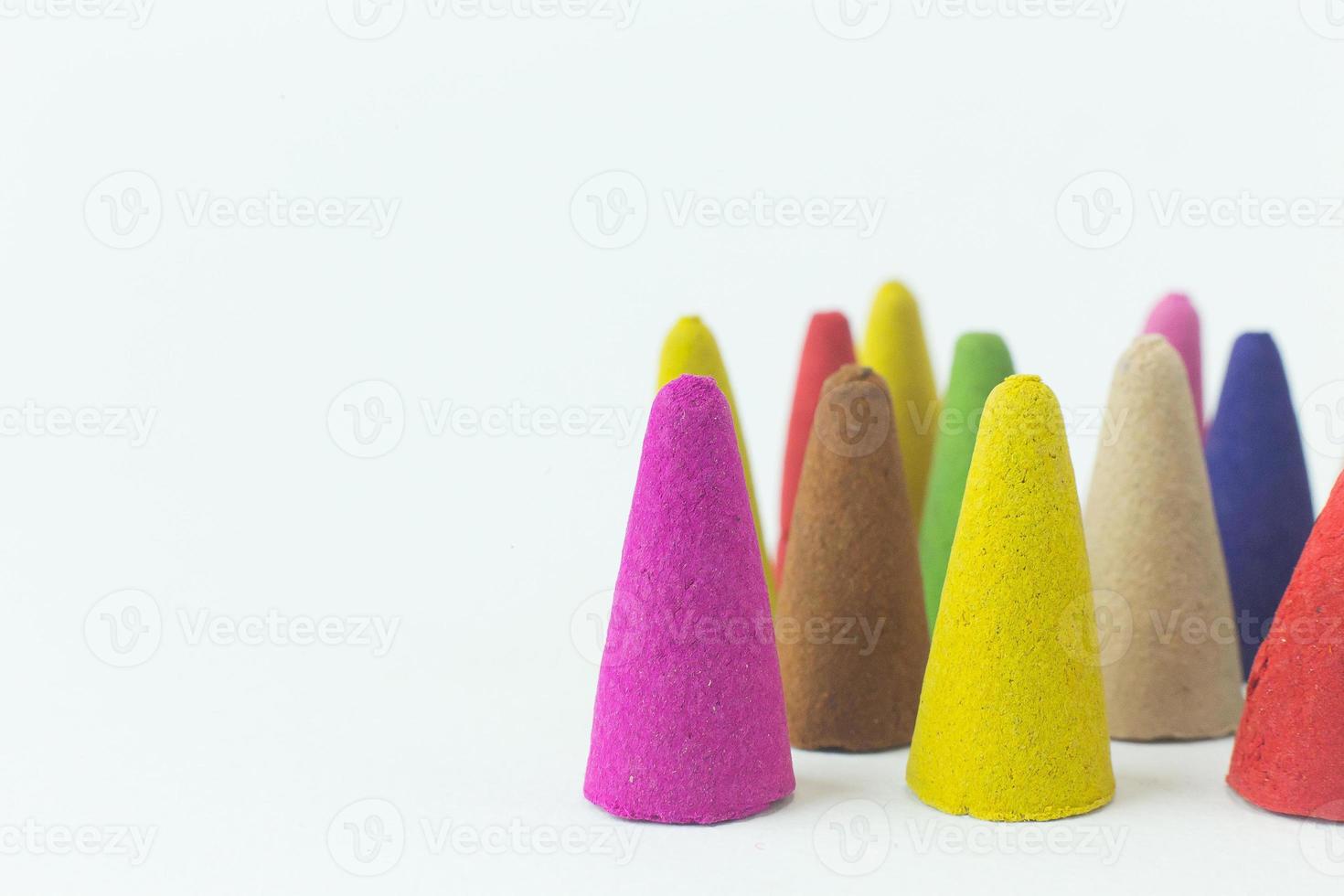 Incense Cone in a stand with the feather for background. photo