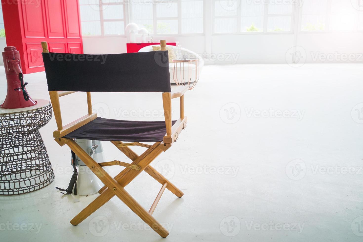 Behind the scenes the director chair in white set for background. photo