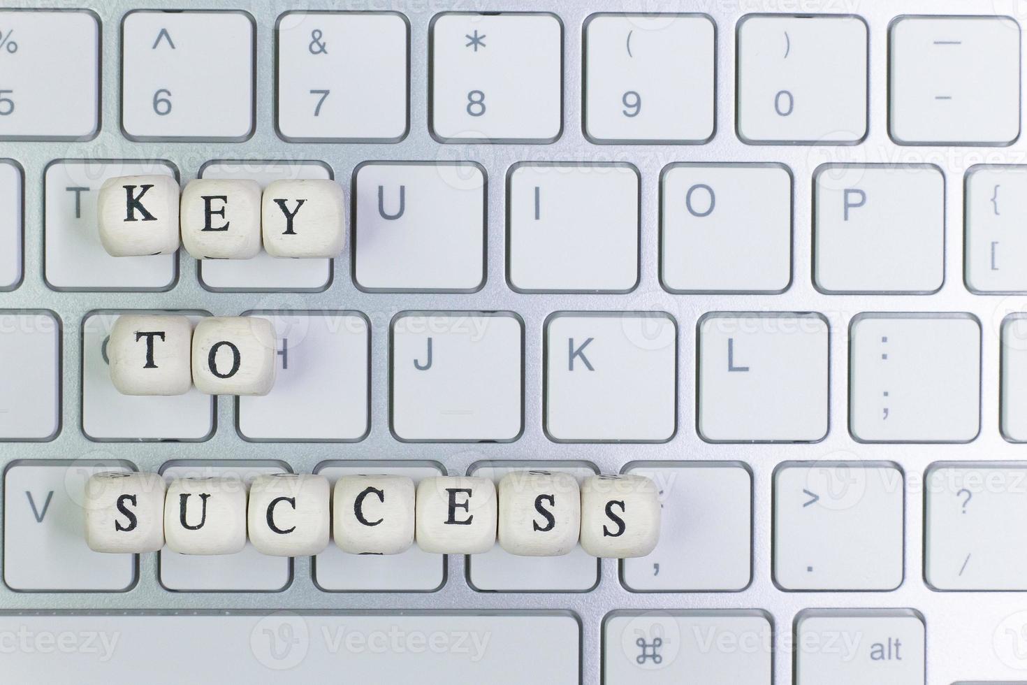 concept key to success on  wood cube for background. photo