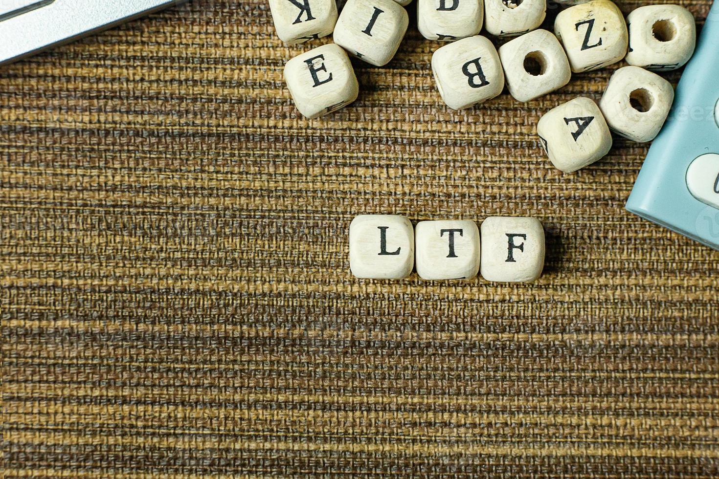 Text LTF on wooden cube image  for business content. photo