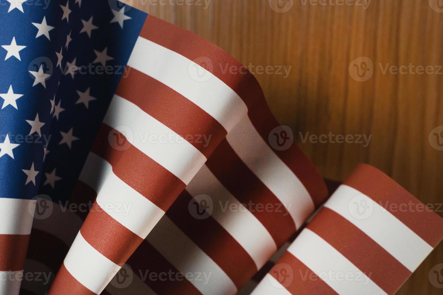 The Veterans Day  concept united states of America flag on wood background. photo