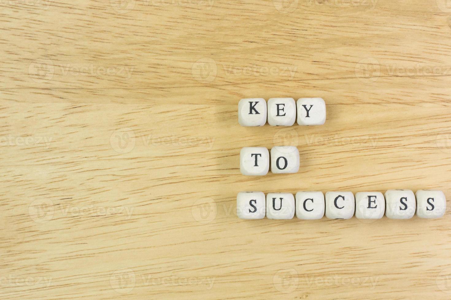 concept key to success on  wood cube for background. photo