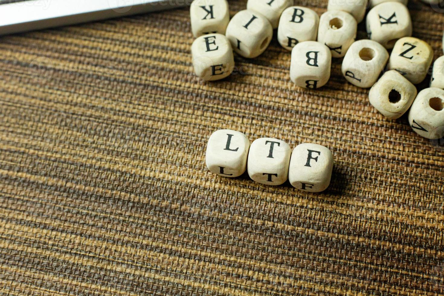 Text LTF on wooden cube image  for business content. photo